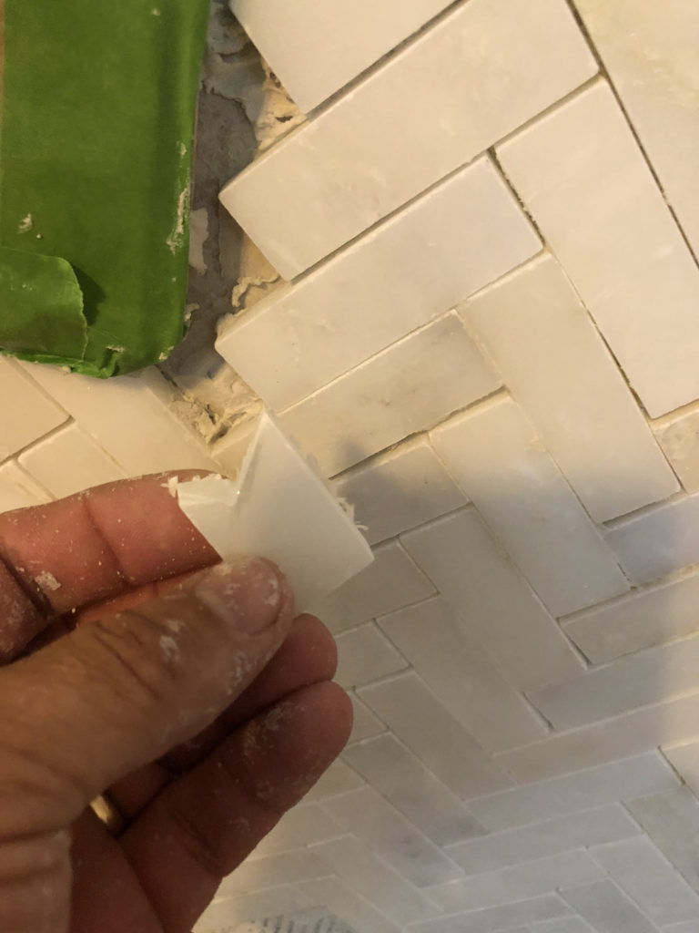 Cutting individual mosaic tiles for an electric fireplace mantle insert